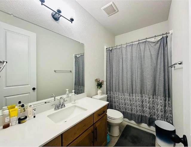 bathroom featuring vanity, a shower with curtain, and toilet