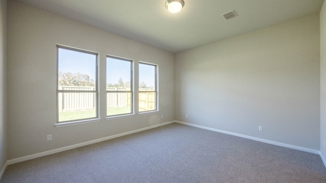 unfurnished room featuring carpet flooring