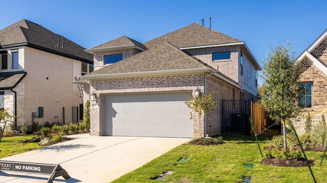 view of front of house with a garage and a front lawn