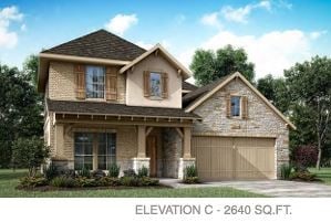 view of front of home featuring covered porch and a garage