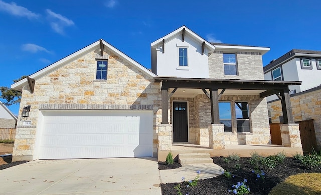 view of front of house with a porch and a garage