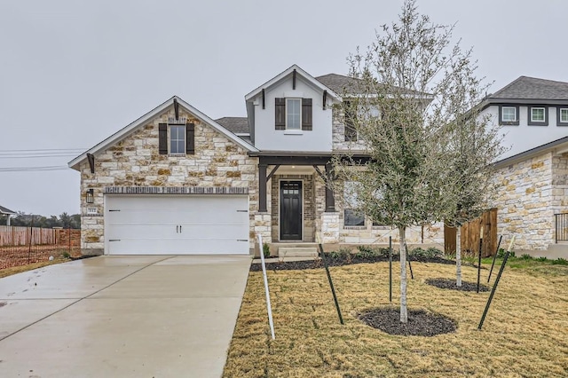 view of front of home with a garage and a front yard