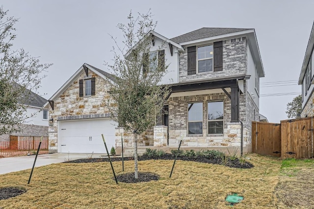 view of front of property featuring a garage and a front lawn