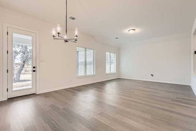 interior space featuring hardwood / wood-style floors and a chandelier