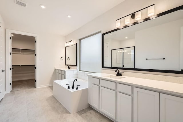 bathroom with plus walk in shower and vanity