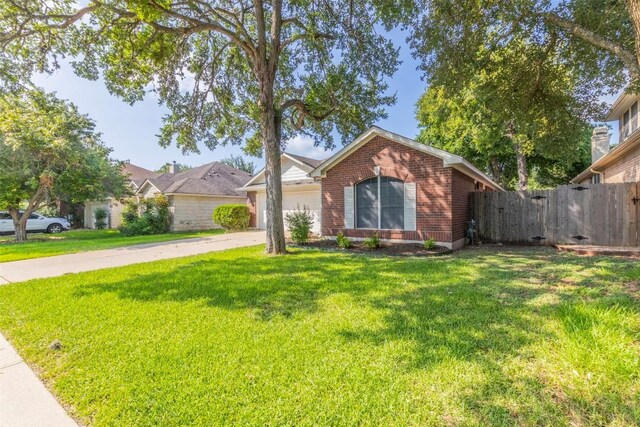 single story home with a front lawn