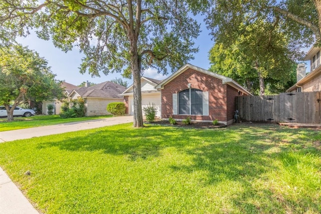 ranch-style home featuring a garage and a front yard