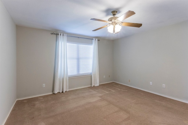 spare room with ceiling fan and carpet flooring