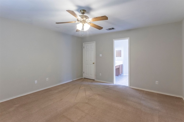 spare room with ceiling fan and carpet flooring