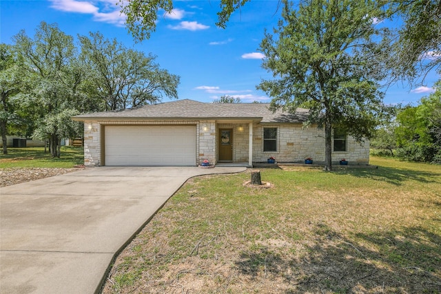 ranch-style house featuring a garage and a front lawn