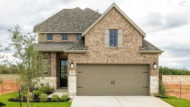 view of front of property with a garage