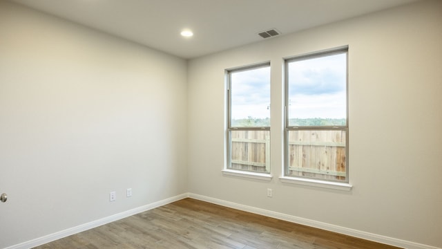 unfurnished room featuring light hardwood / wood-style flooring