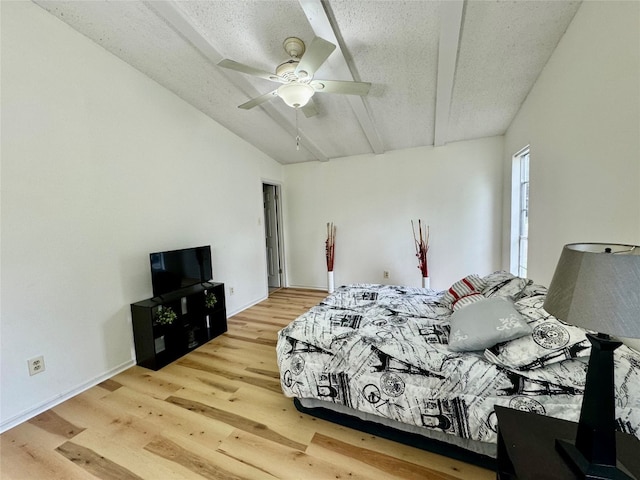 bedroom featuring a textured ceiling, ceiling fan, vaulted ceiling, and light hardwood / wood-style floors