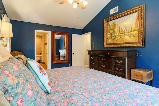 bedroom with ceiling fan, ensuite bathroom, and vaulted ceiling