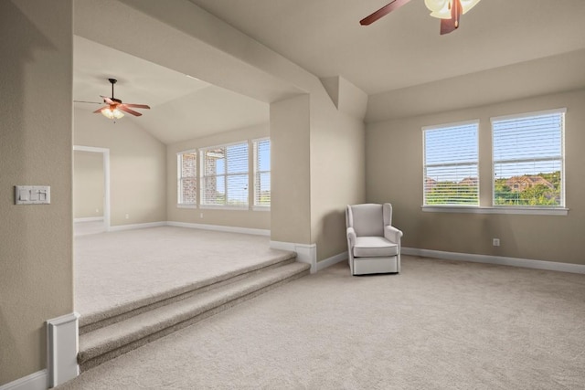 unfurnished room featuring carpet floors, vaulted ceiling, and ceiling fan