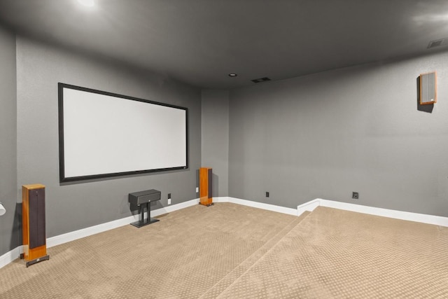 carpeted cinema room with visible vents, recessed lighting, and baseboards