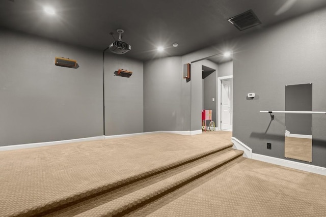 home theater room with baseboards, visible vents, carpet flooring, and recessed lighting