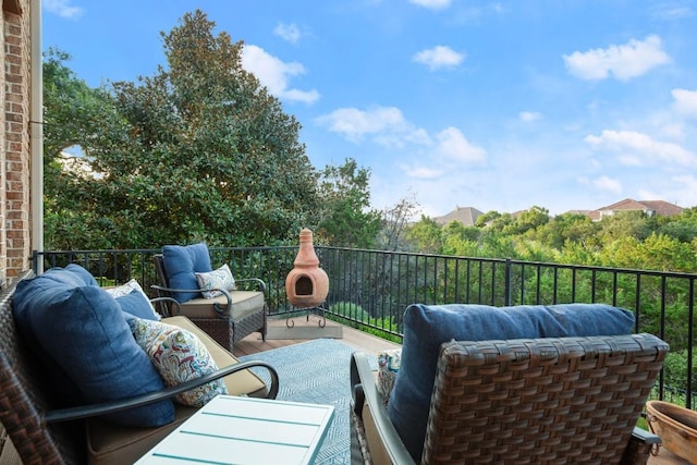 view of patio with a balcony and outdoor lounge area