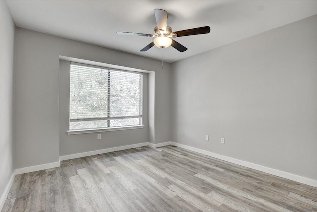 empty room featuring ceiling fan and light wood-type flooring