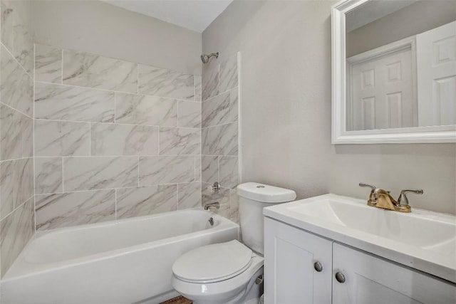 full bathroom with tiled shower / bath combo, vanity, and toilet