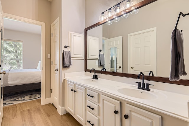 bathroom featuring hardwood / wood-style flooring and vanity