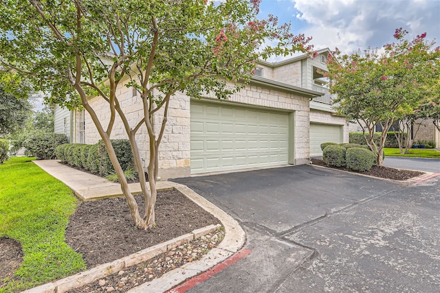 view of side of home featuring a garage