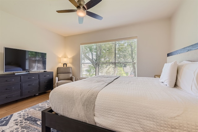 bedroom with ceiling fan and light wood-type flooring