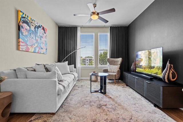 living room featuring hardwood / wood-style flooring and ceiling fan