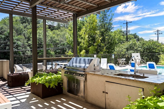 view of patio / terrace featuring a pergola, an outdoor hangout area, sink, area for grilling, and an outdoor kitchen