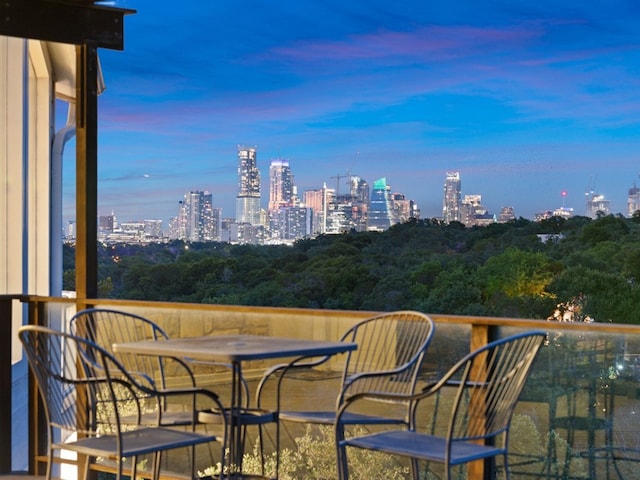 view of balcony at dusk