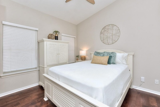 bedroom with vaulted ceiling, dark hardwood / wood-style floors, and ceiling fan