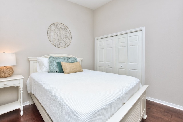 bedroom featuring a closet and dark hardwood / wood-style flooring