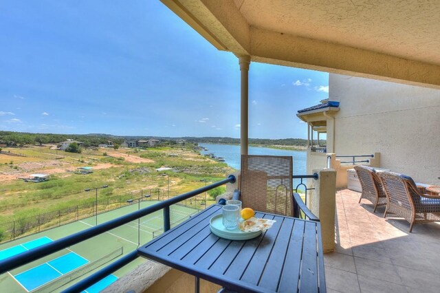 balcony featuring a water view