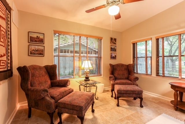 sitting room featuring light tile patterned floors and ceiling fan