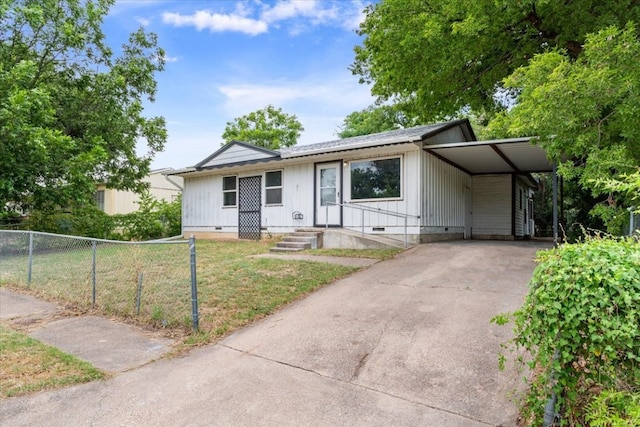 ranch-style home featuring a carport