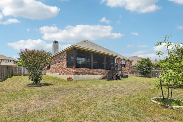 view of yard with a sunroom