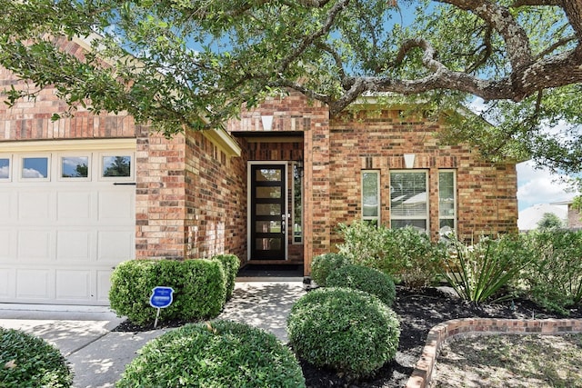 view of exterior entry featuring a garage