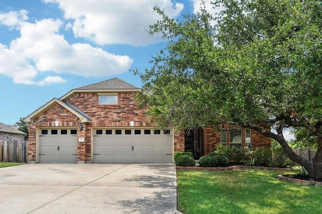 view of front of house featuring a front lawn and a garage