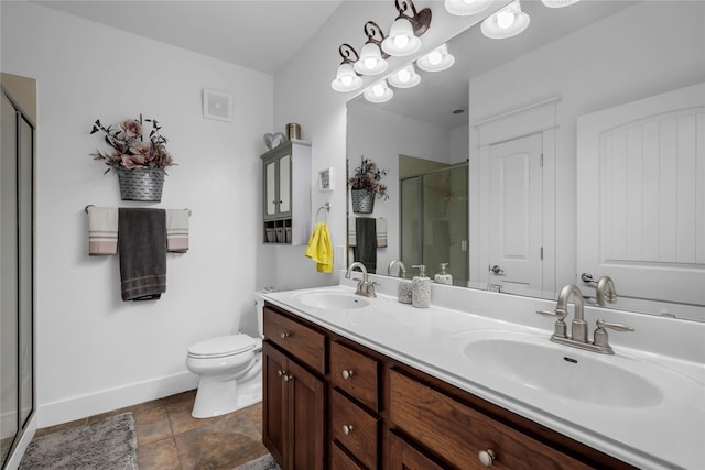 bathroom with a shower with door, vanity, and toilet