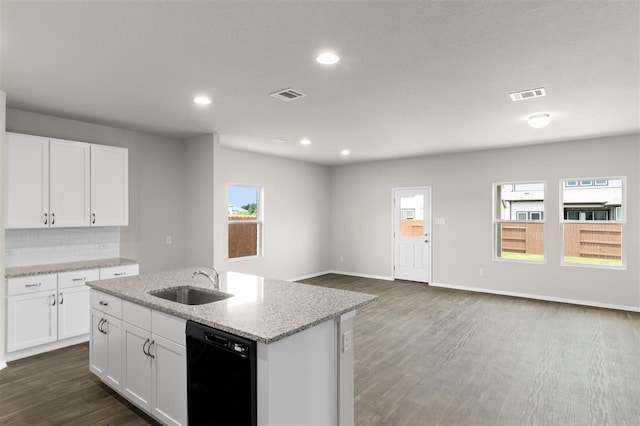 kitchen with a kitchen island with sink, dishwasher, sink, and white cabinets