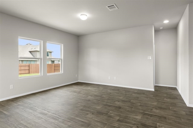 empty room featuring dark hardwood / wood-style floors