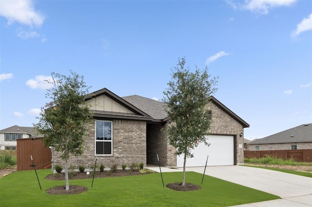 view of front of property with a garage and a front yard