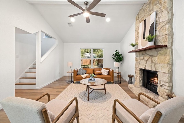 11506 Fence Post Trl, Austin, TX 78750 - living room with a ceiling fan, a fireplace, baseboards, wood finished floors, and stairway