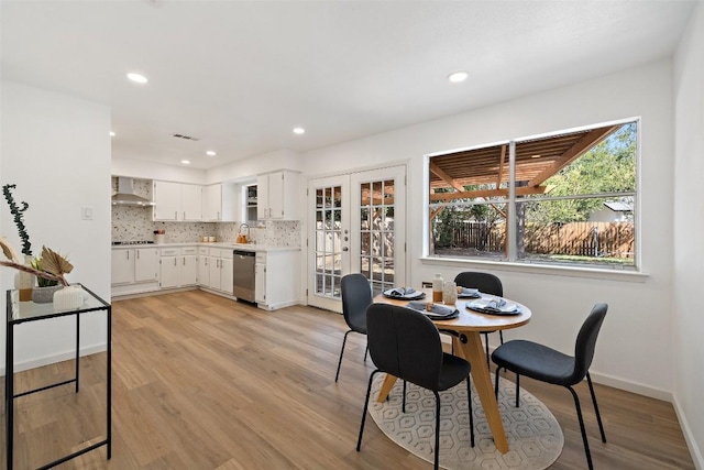 11506 Fence Post Trl, Austin, TX 78750 - dining area featuring light wood finished floors, recessed lighting, baseboards, and french doors