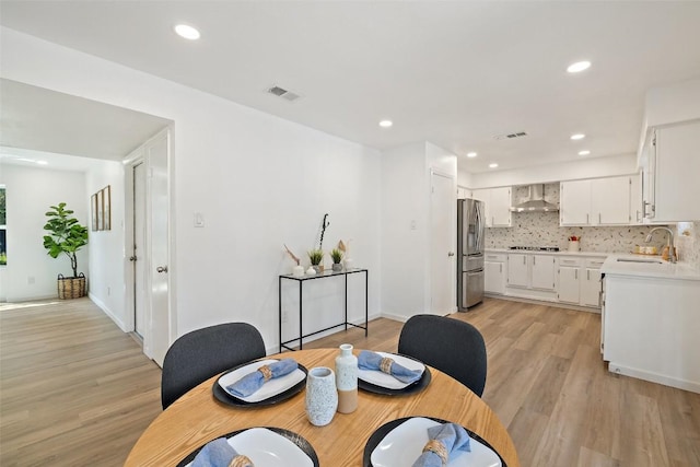 11506 Fence Post Trl, Austin, TX 78750 - dining area with light wood finished floors, recessed lighting, and baseboards