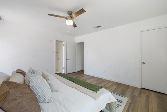 11506 Fence Post Trl, Austin, TX 78750 - bedroom featuring wood finished floors and a ceiling fan