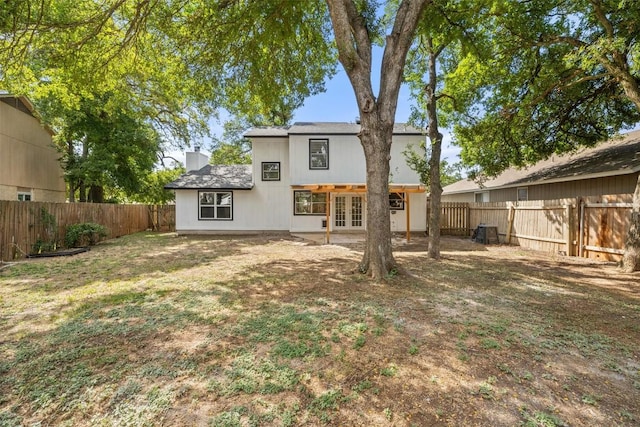 11506 Fence Post Trl, Austin, TX 78750 - back of house with french doors and a chimney