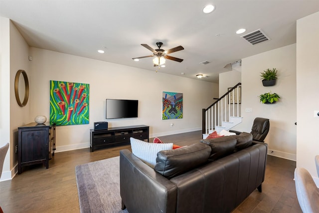 living room with dark wood-type flooring and ceiling fan