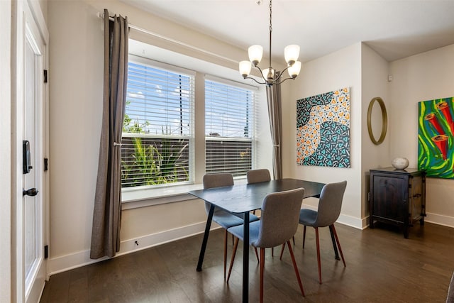 dining room featuring dark wood-type flooring and a chandelier