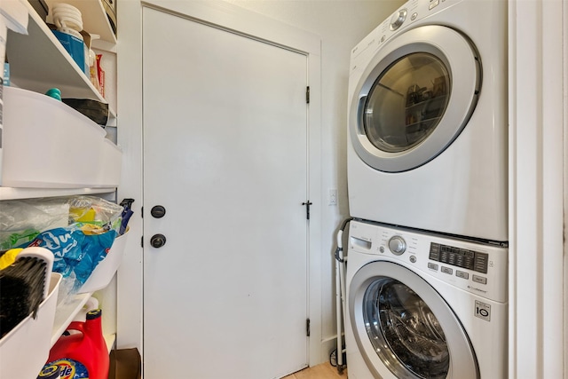 washroom featuring stacked washer / dryer